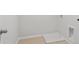 Bright laundry room with tile floor and built-in utility sink at 714 Smokey Quartz Way, Kennesaw, GA 30144