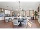 Bright, open-concept living room with hardwood floors, modern lighting, and comfortable seating at 714 Smokey Quartz Way, Kennesaw, GA 30144