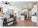 Open-concept living room with wood floors, modern lighting, and a view into the kitchen at 714 Smokey Quartz Way, Kennesaw, GA 30144