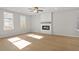 Bright living room featuring hardwood floors and a modern fireplace at 714 Smokey Quartz Way, Kennesaw, GA 30144