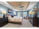 Tranquil main bedroom with a tray ceiling, soft blue walls, and large windows at 714 Smokey Quartz Way, Kennesaw, GA 30144