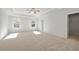 Spacious main bedroom with carpet, ceiling fan, and walk-in closet at 714 Smokey Quartz Way, Kennesaw, GA 30144