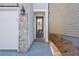Side entrance with gray door and brick walkway at 714 Smokey Quartz Way, Kennesaw, GA 30144