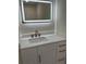 Modern bathroom with white vanity, quartz countertop, and LED mirror at 1706 Alvarado Sw Ter, Atlanta, GA 30310