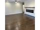 Spacious living room featuring hardwood floors and a modern fireplace at 1706 Alvarado Sw Ter, Atlanta, GA 30310