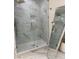 Bathroom features walk-in shower with marble tile and glass door at 1706 Alvarado Sw Ter, Atlanta, GA 30310