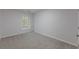 Bedroom with carpet flooring and a window providing natural light at 1886 Carisbrook Pl, Austell, GA 30168