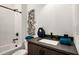 Clean bathroom with tub, shower, and dark vanity at 2199 Lenox Ne Rd # 14, Atlanta, GA 30324