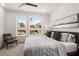Bright bedroom with king-size bed and large windows at 2199 Lenox Ne Rd # 14, Atlanta, GA 30324