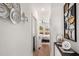 Bright hallway with decorative wall art and access to bedroom at 2199 Lenox Ne Rd # 14, Atlanta, GA 30324