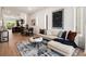 Open concept living space with sectional sofa and large artwork at 2199 Lenox Ne Rd # 14, Atlanta, GA 30324