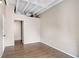 Simple bedroom with hardwood floors and access to hallway at 32 Peachtree Nw St # 308, Atlanta, GA 30303