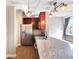 Modern kitchen with stainless steel appliances and wood cabinets at 32 Peachtree Nw St # 308, Atlanta, GA 30303
