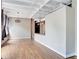 Open living room with hardwood floors and exposed beams at 32 Peachtree Nw St # 308, Atlanta, GA 30303