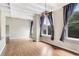 Spacious living room with hardwood floors and large windows at 32 Peachtree Nw St # 308, Atlanta, GA 30303