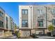 Contemporary townhome featuring a multi-tone exterior, private garages, and well-maintained landscaping at 2199 Lenox Ne Rd # 13, Atlanta, GA 30324