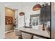 Eat-in kitchen with stone countertops, pendant lighting, and modern stools at 2199 Lenox Ne Rd # 13, Atlanta, GA 30324