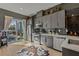Modern kitchen with gray cabinets, stainless steel appliances, and a sliding glass door to the outside at 2199 Lenox Ne Rd # 13, Atlanta, GA 30324
