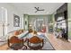 Living room with fireplace, large windows, and access to an outdoor balcony at 2199 Lenox Ne Rd # 13, Atlanta, GA 30324