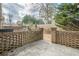 Brick patio and backyard with a brick wall at 2349 Sandy Oaks Dr, Marietta, GA 30066