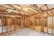 Unfinished basement with framed walls and insulation at 135 Eagles Club Dr, Stockbridge, GA 30281