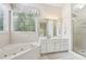 Elegant bathroom, featuring a soaking tub and shower at 135 Eagles Club Dr, Stockbridge, GA 30281