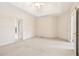 Bright bedroom with ceiling fan and ample space at 135 Eagles Club Dr, Stockbridge, GA 30281