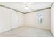 Charming bedroom with ceiling fan and window at 135 Eagles Club Dr, Stockbridge, GA 30281