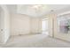 Well-lit bedroom featuring a ceiling fan and access to another room at 135 Eagles Club Dr, Stockbridge, GA 30281