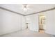 Spacious bedroom with ceiling fan and access to a bathroom and loft at 135 Eagles Club Dr, Stockbridge, GA 30281