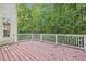 Wooden deck overlooking a wooded backyard at 135 Eagles Club Dr, Stockbridge, GA 30281