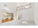 Open floor plan Gathering room with kitchen and high ceilings at 135 Eagles Club Dr, Stockbridge, GA 30281