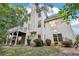 Two story house with raised deck and patio at 135 Eagles Club Dr, Stockbridge, GA 30281