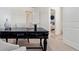 Bright and airy home office with a black wooden desk and neutral decor at 2458 Bayberry St, Acworth, GA 30101