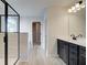 Bright bathroom with a vanity, walk-in shower with glass enclosure, and wood-look flooring at 4361 Portsbrook Ave, Snellville, GA 30039