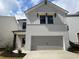 Charming two-story home with a brick facade and a spacious attached two-car garage at 4361 Portsbrook Ave, Snellville, GA 30039