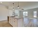 Modern kitchen with white cabinets, granite countertops, and stainless steel faucet at 4361 Portsbrook Ave, Snellville, GA 30039
