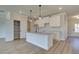 Modern kitchen with white cabinets, granite countertops, and stainless steel faucet at 4361 Portsbrook Ave, Snellville, GA 30039