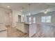 Modern kitchen with granite countertop island and white shaker cabinets at 4361 Portsbrook Ave, Snellville, GA 30039