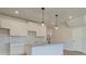 Modern kitchen with white cabinets, granite countertops, and stainless steel faucet at 4361 Portsbrook Ave, Snellville, GA 30039