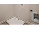 Laundry room with floor drain, utility connections, and neutral color scheme at 4361 Portsbrook Ave, Snellville, GA 30039