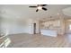 Open living room with luxury vinyl plank flooring next to a kitchen with a center island at 4361 Portsbrook Ave, Snellville, GA 30039