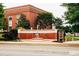 War memorial fountain near red brick building with landscaped surroundings at 4361 Portsbrook Ave, Snellville, GA 30039