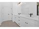 Elegant bathroom, featuring a double vanity and white cabinets at 19 Bridgemill Dr, Douglasville, GA 30134