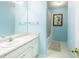 Bathroom with light blue walls and a tub shower combo at 571 Oak Vista Ct, Lawrenceville, GA 30044