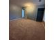 Bedroom featuring carpeted floors, gray walls, a closet, and natural light at 571 Oak Vista Ct, Lawrenceville, GA 30044