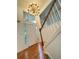 Bright foyer with hardwood floors, chandelier, and staircase leading to the upper level at 571 Oak Vista Ct, Lawrenceville, GA 30044