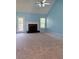 Spacious living room with vaulted ceiling, fireplace, and a door leading to the outdoors at 571 Oak Vista Ct, Lawrenceville, GA 30044