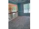 Second floor loft area with plush carpeting, chandelier, and an abundance of natural light at 571 Oak Vista Ct, Lawrenceville, GA 30044