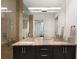 Bathroom featuring double vanity, granite countertops, and a glass shower with stone tile surround at 3325 Piedmont Ne Rd # 2407, Atlanta, GA 30305